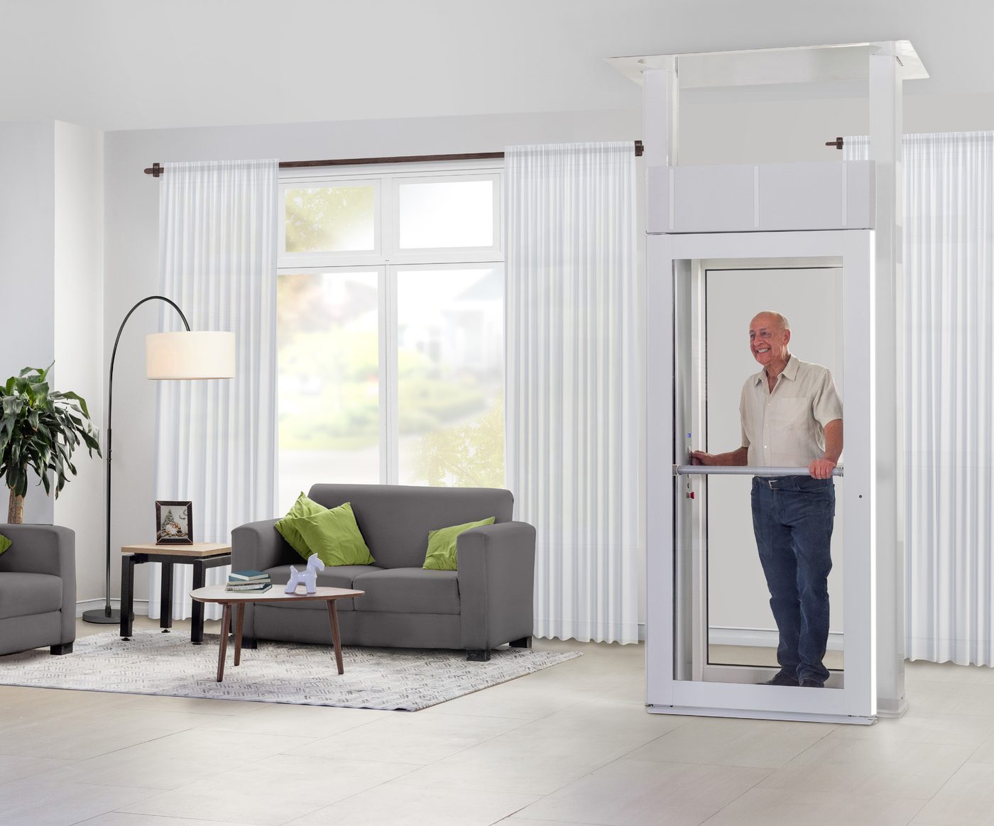 Savaria Luma through-floor home lift with a full-height door and a sloped low-level threshold