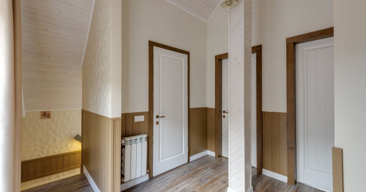 Narrow hallway with doorways in a home